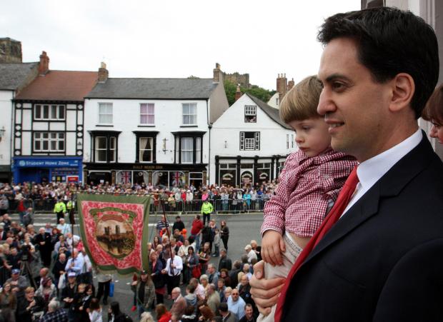 The Northern Echo: Labour leader Ed Miliband, carries his son Daniel, aged 3, prior to making his speech at the Durham Miners' Gala on the old Racecourse, Durham..